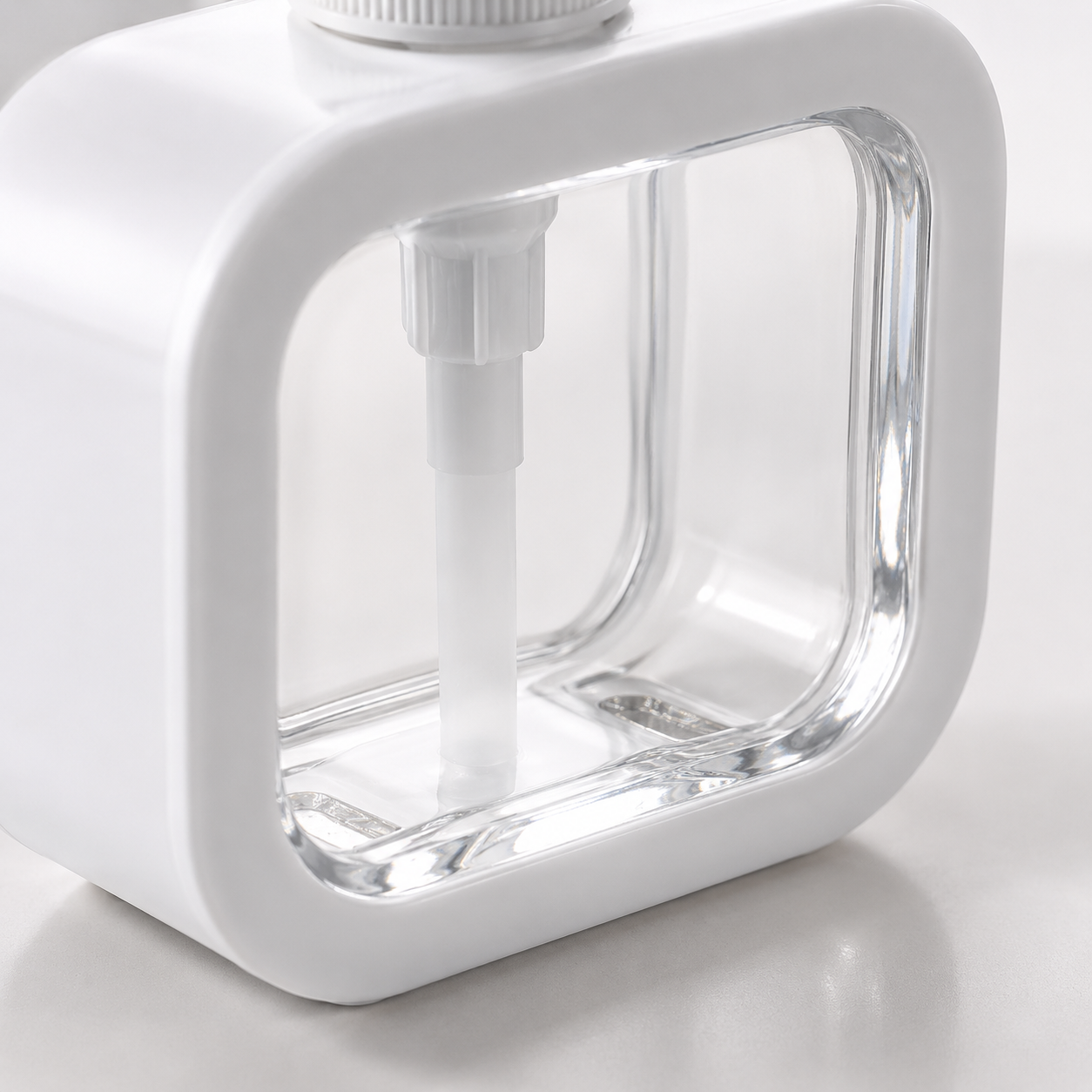 Hand Wash Storage Pump Bottle close-up displaying crystal clear refillable reservoir and durable square plastic dispenser construction