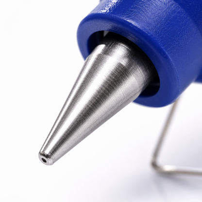 Macro view of the precision metal nozzle on a 20W hot melt glue gun, designed for controlled glue application in crafts, decorations and DIY projects.