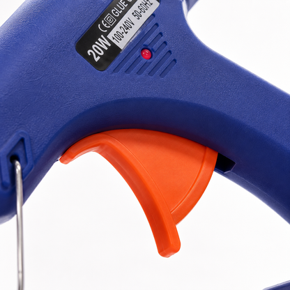 Close-up of a 20W mini hot melt glue gun featuring an ergonomic trigger, LED power indicator and heat-resistant body for precise crafting and DIY repairs.