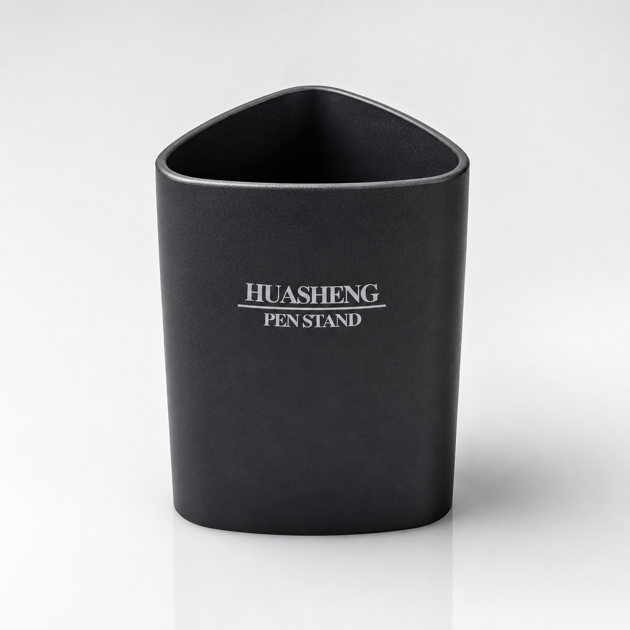 Black Huasheng Pen Stand with a rounded triangular design and smooth matte finish, displayed on a clean white studio background for office, study and home desk organization.