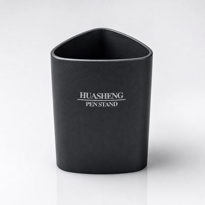 Black Huasheng Pen Stand with a rounded triangular design and smooth matte finish, displayed on a clean white studio background for office, study and home desk organization.