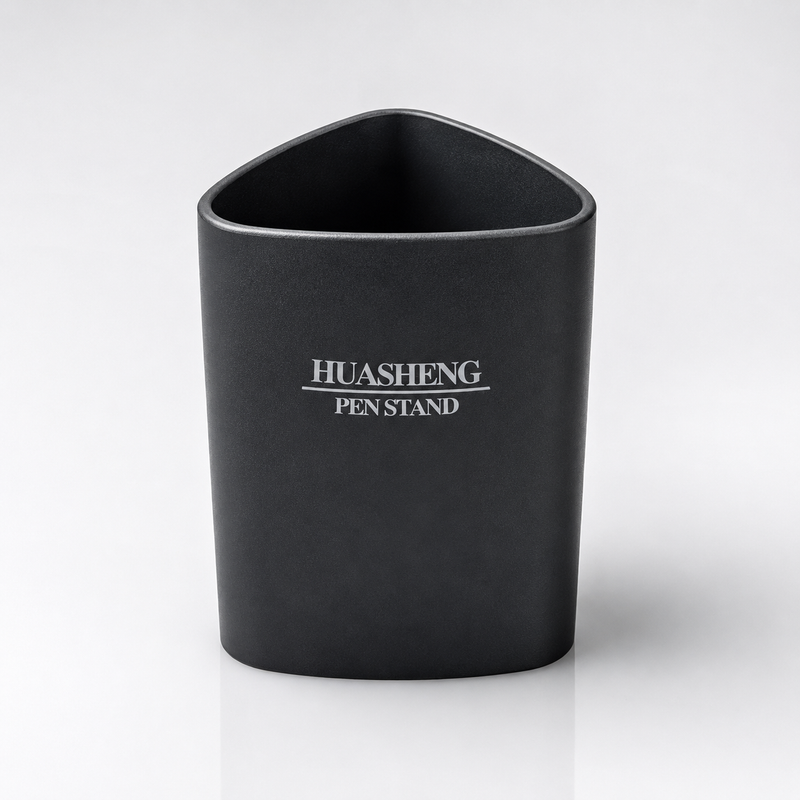 Black Huasheng Pen Stand with a rounded triangular design and smooth matte finish, displayed on a clean white studio background for office, study and home desk organization.