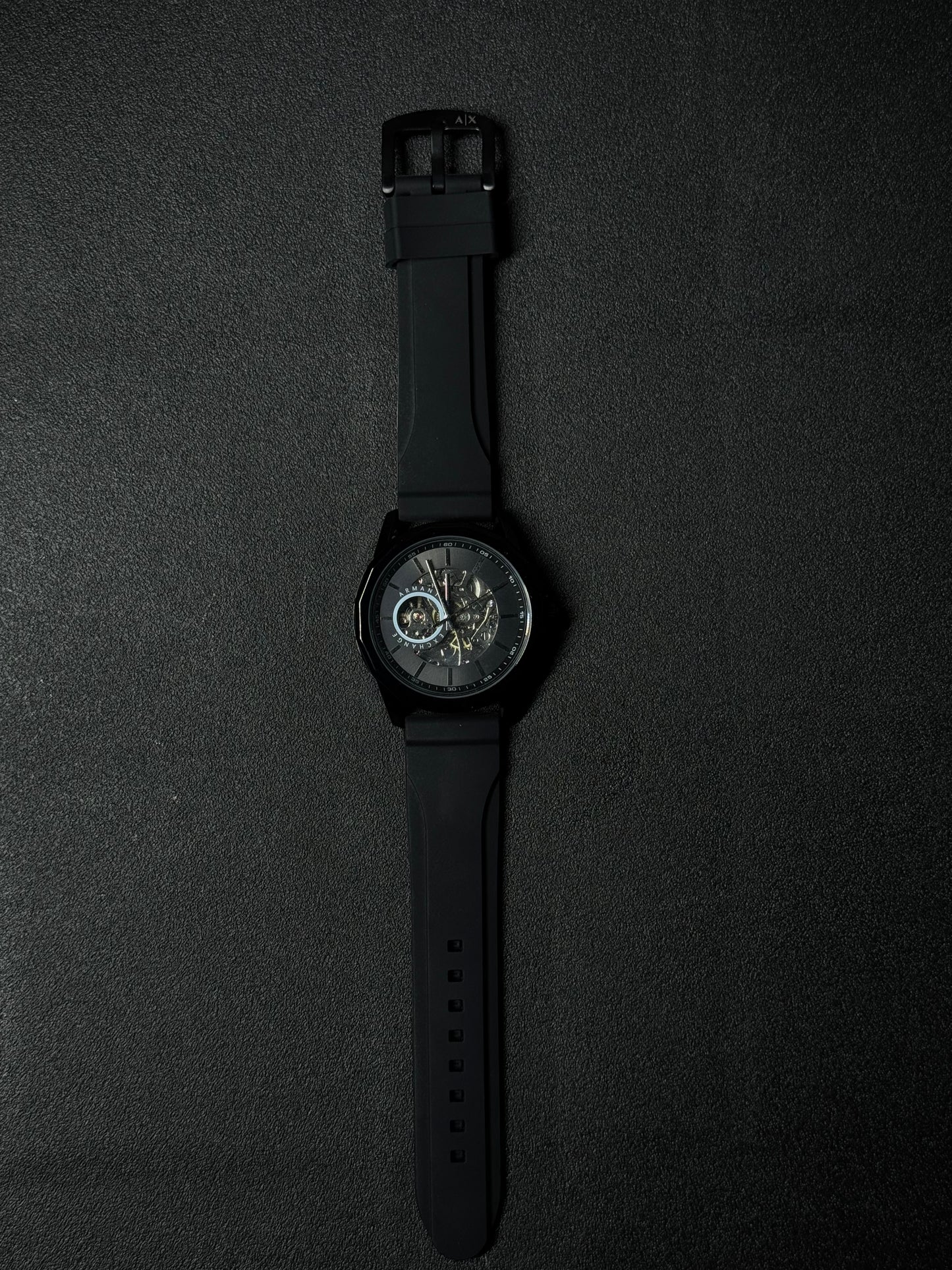Black strap replica watch with skeleton dial, automatic-style design, premium sports wristwatch and black case finish