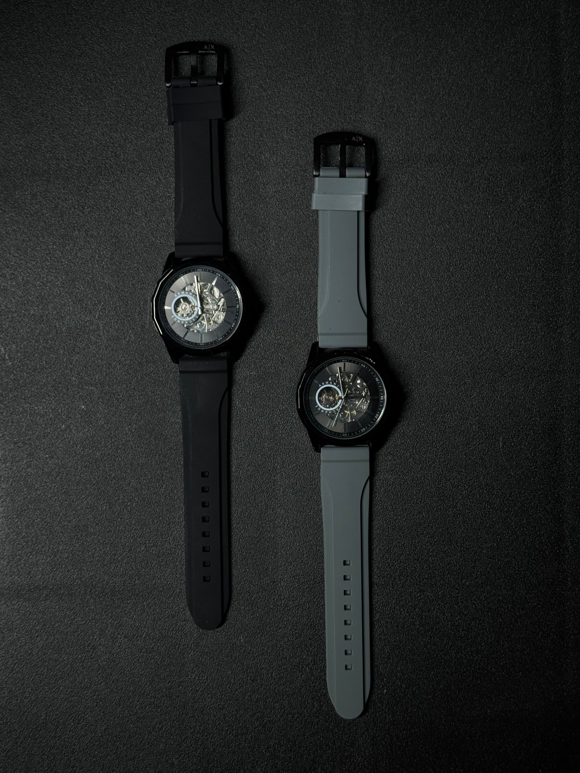 Replica watch collection featuring black and grey silicone straps, skeleton dials and luxury sports watch design