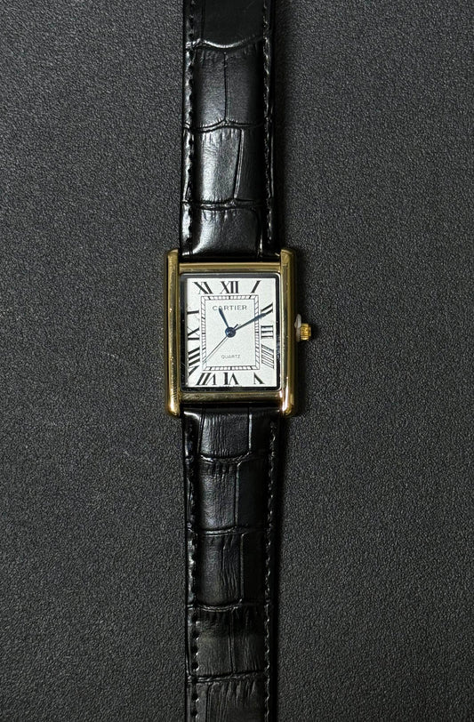 Luxury inspired replica watch with black crocodile texture leather strap, white rectangular dial and Roman numeral hour markers 
