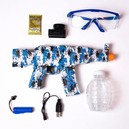 Top-down view of the Kids Electric Gel Blaster Gun Kit with Safety Glasses, featuring the gel blaster, safety glasses, gel ball packets, water bottle container, USB cable, and rechargeable battery.