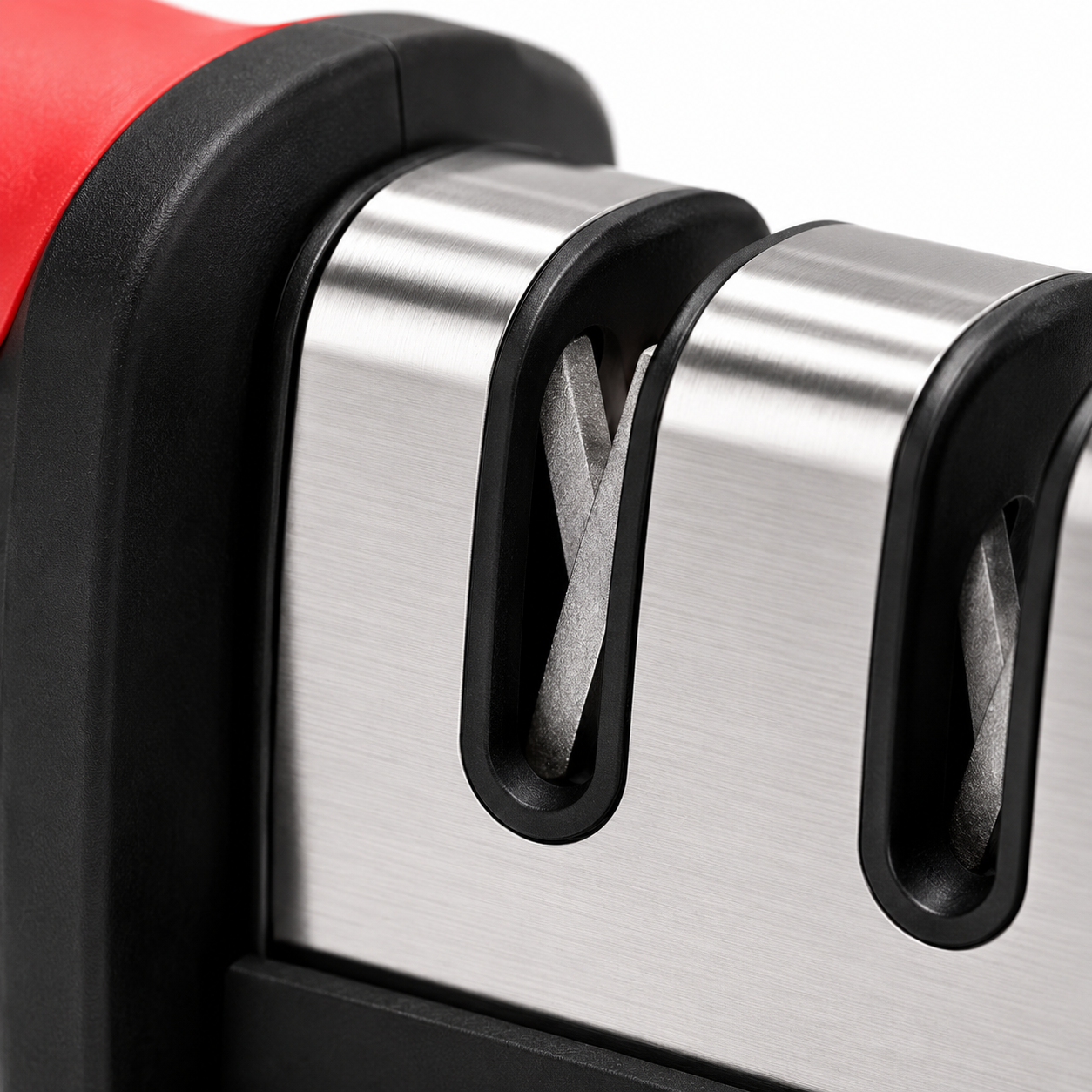 Extreme close-up of the coarse sharpening slot on a 3-stage manual knife sharpener, showcasing precision tungsten steel sharpening blades with a brushed stainless steel finish and durable construction.