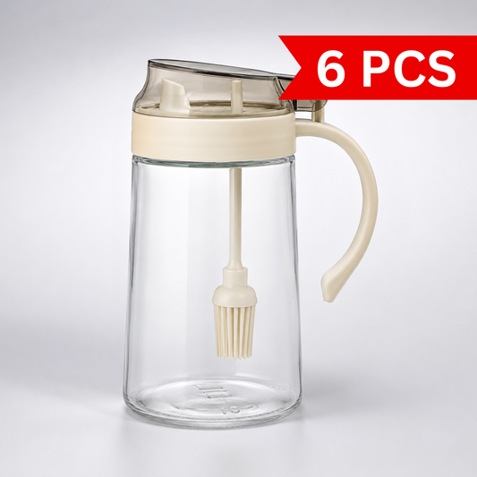 Lexi Glass Oil Dispenser with Brush 500ml transparent glass oil bottle with handle, built-in silicone brush and easy-pour lid for cooking and baking.