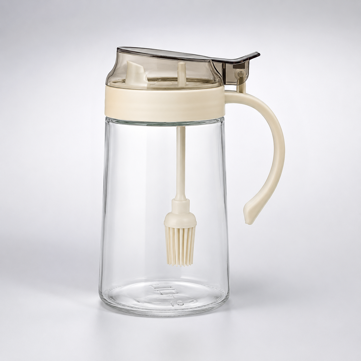 Lexi Glass Oil Dispenser with Brush 500ml transparent glass oil bottle with handle, built-in silicone brush and easy-pour lid for cooking and baking.