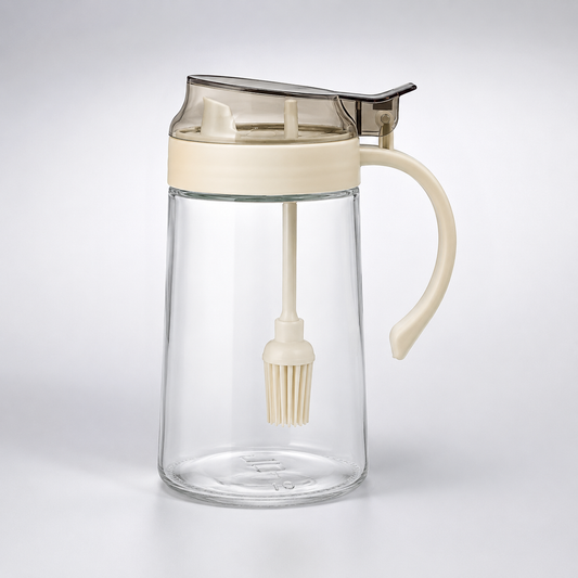 Lexi Glass Oil Dispenser with Brush 500ml transparent glass oil bottle with handle, built-in silicone brush and easy-pour lid for cooking and baking.