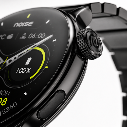 Extreme macro photography highlighting the precision rotating crown and side function button of the black metal smartwatch, showcasing premium machining, polished finish and luxury craftsmanship.