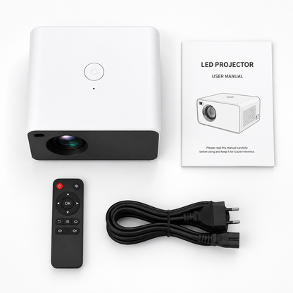 Complete portable LED projector package including projector, remote control, AC power cable, and user manual neatly arranged on a white background for ecommerce product display.