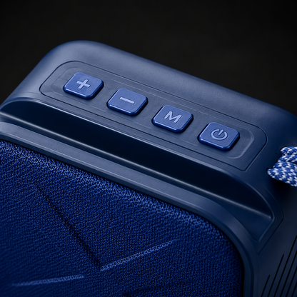 Close-up of the top-mounted control panel on a portable Bluetooth speaker featuring volume controls, multifunction button, power button, durable construction, and textured fabric speaker grille.