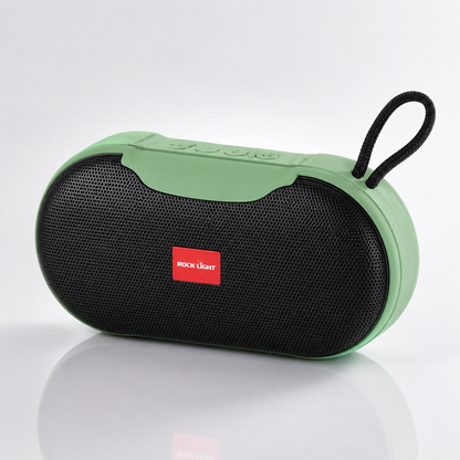 Rock Light Magic S156 portable Bluetooth speaker in green and black finish with front metal mesh grille, integrated carry loop, rechargeable battery, and compact travel-friendly design