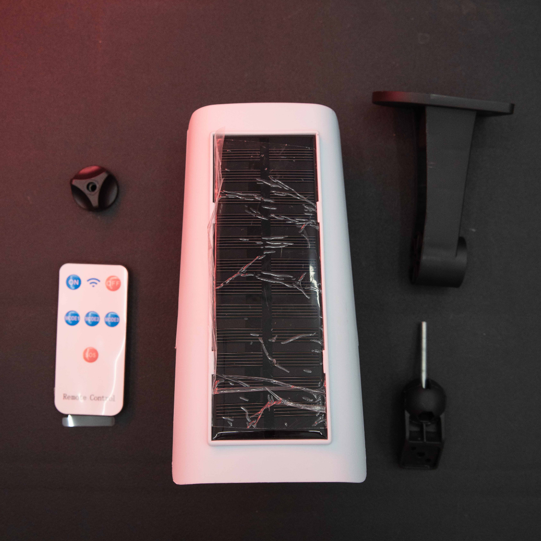 Rear solar charging panel of Motion Detection LED Solar Light with outdoor wall mount accessories and remote control