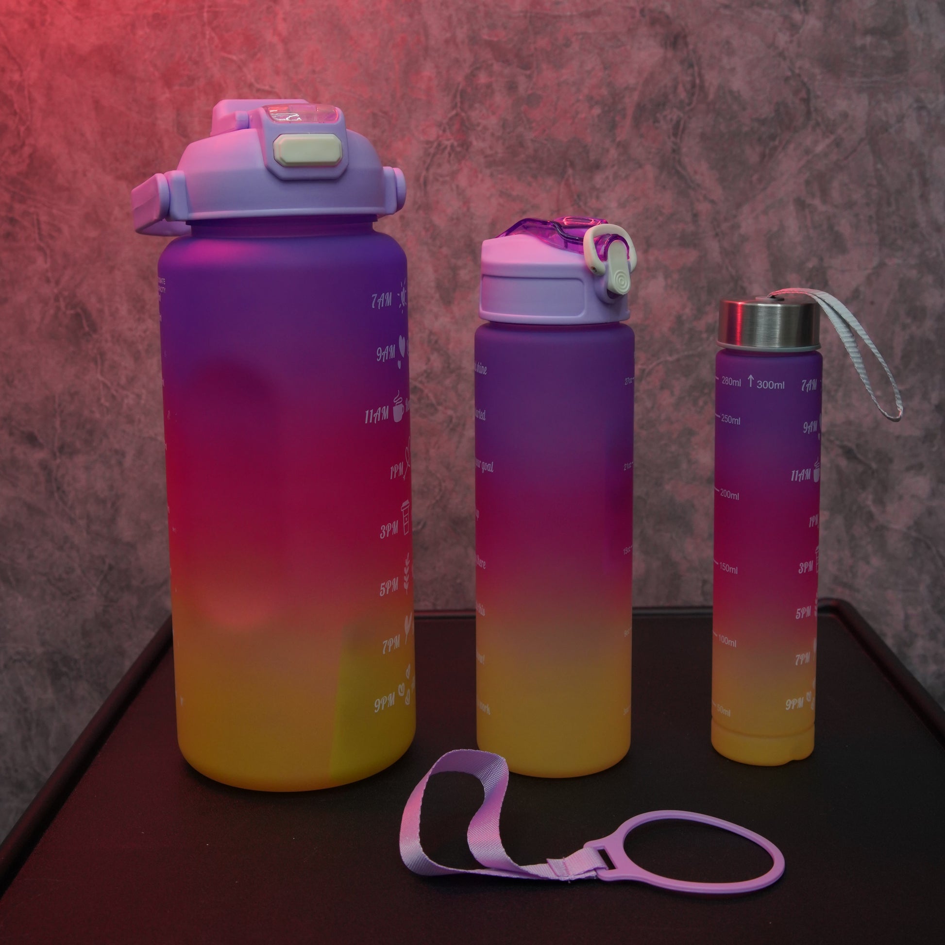 Gradient Hydration Bottle Set with large, medium and small reusable water bottles and detachable carry strap