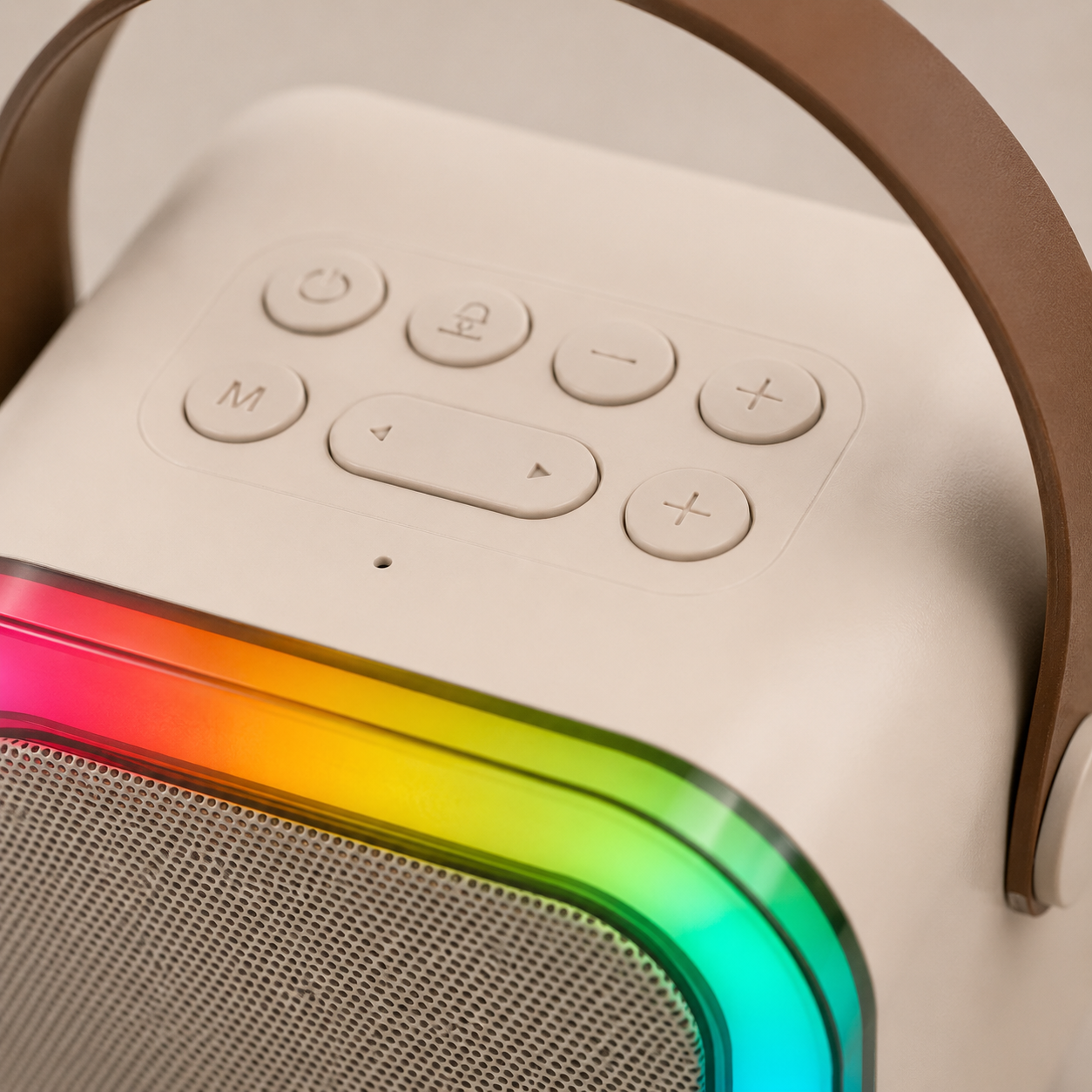 Close-up of the portable karaoke speaker showing top-mounted control buttons, volume controls, playback buttons, mode selection, and vibrant RGB light frame surrounding the front speaker grille.