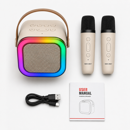 Complete karaoke speaker package including RGB wireless speaker, two wireless microphones, USB charging cable, and user manual neatly arranged