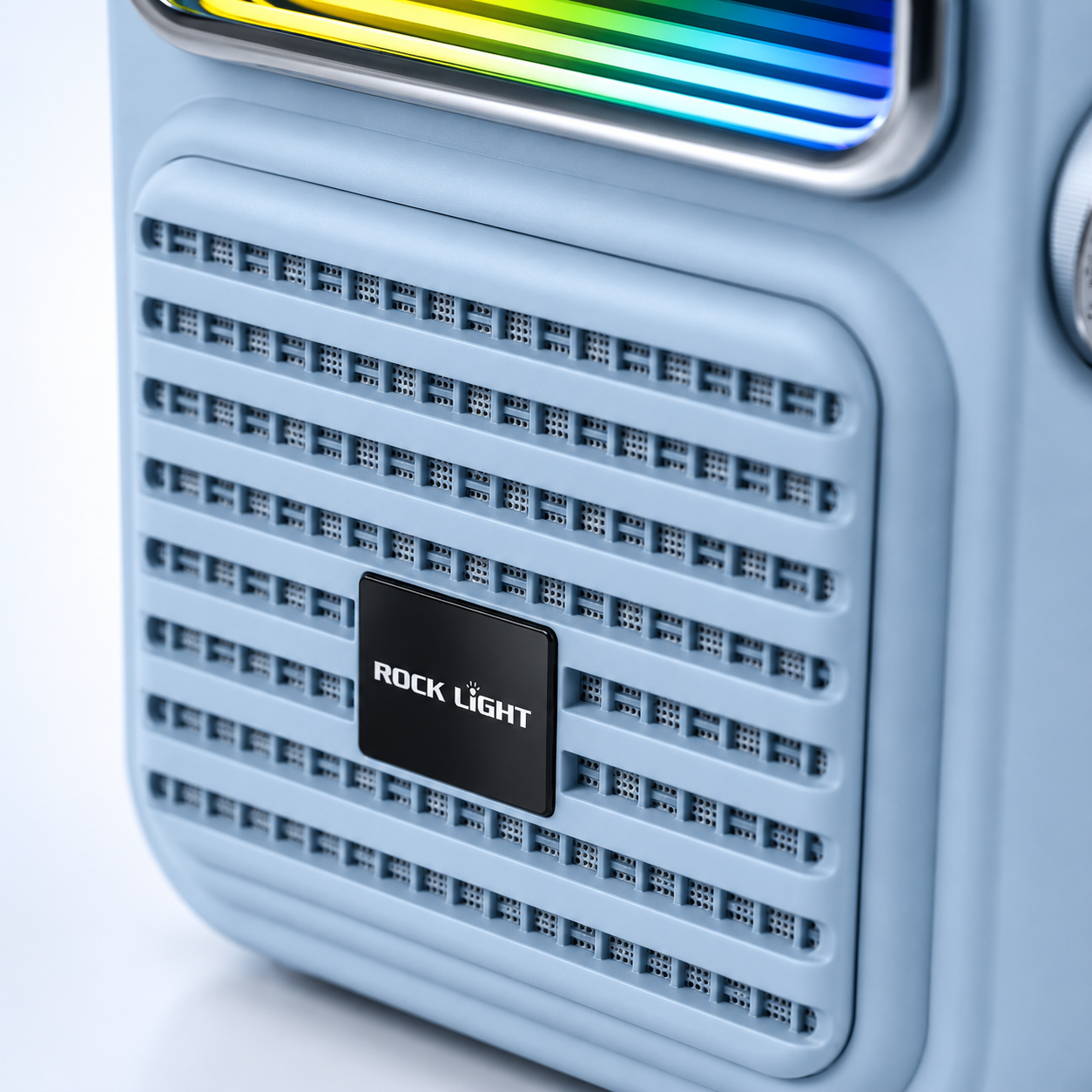 Close-up of a portable Bluetooth karaoke speaker featuring a retro-style front grille, premium blue finish and integrated speaker design with RGB lighting.