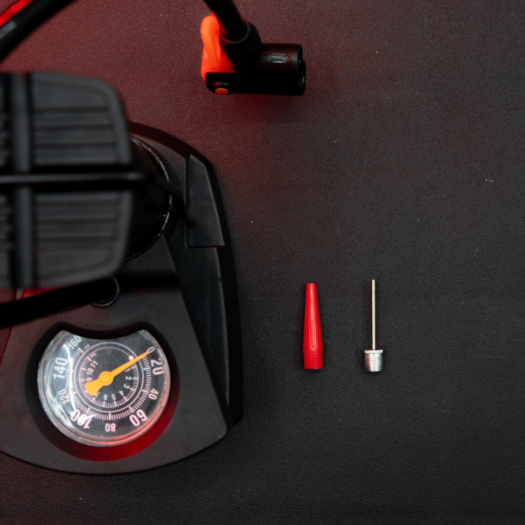 Portable Mini Foot Pump with Pressure Gauge and Inflation Accessories Flat Lay Product Photography