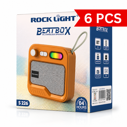 Portable retro-style Bluetooth wireless speaker packaging featuring an orange speaker with metallic front grille, RGB light accent, rotary control knob, carry loop, Bluetooth V5.3 connectivity, rechargeable battery, FM radio, TF card, USB playback, TWS support, and up to 4 hours playtime.