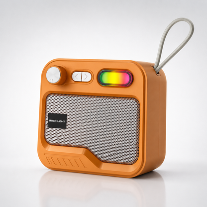 Orange portable Bluetooth speaker with metal mesh grille, rotary control knob, RGB lighting element, built-in carry strap, rechargeable battery, and compact retro-style design