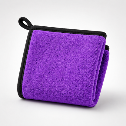 Purple microfiber cleaning cloth with reinforced black stitched edges and hanging loop, soft reusable cleaning towel for home and car care