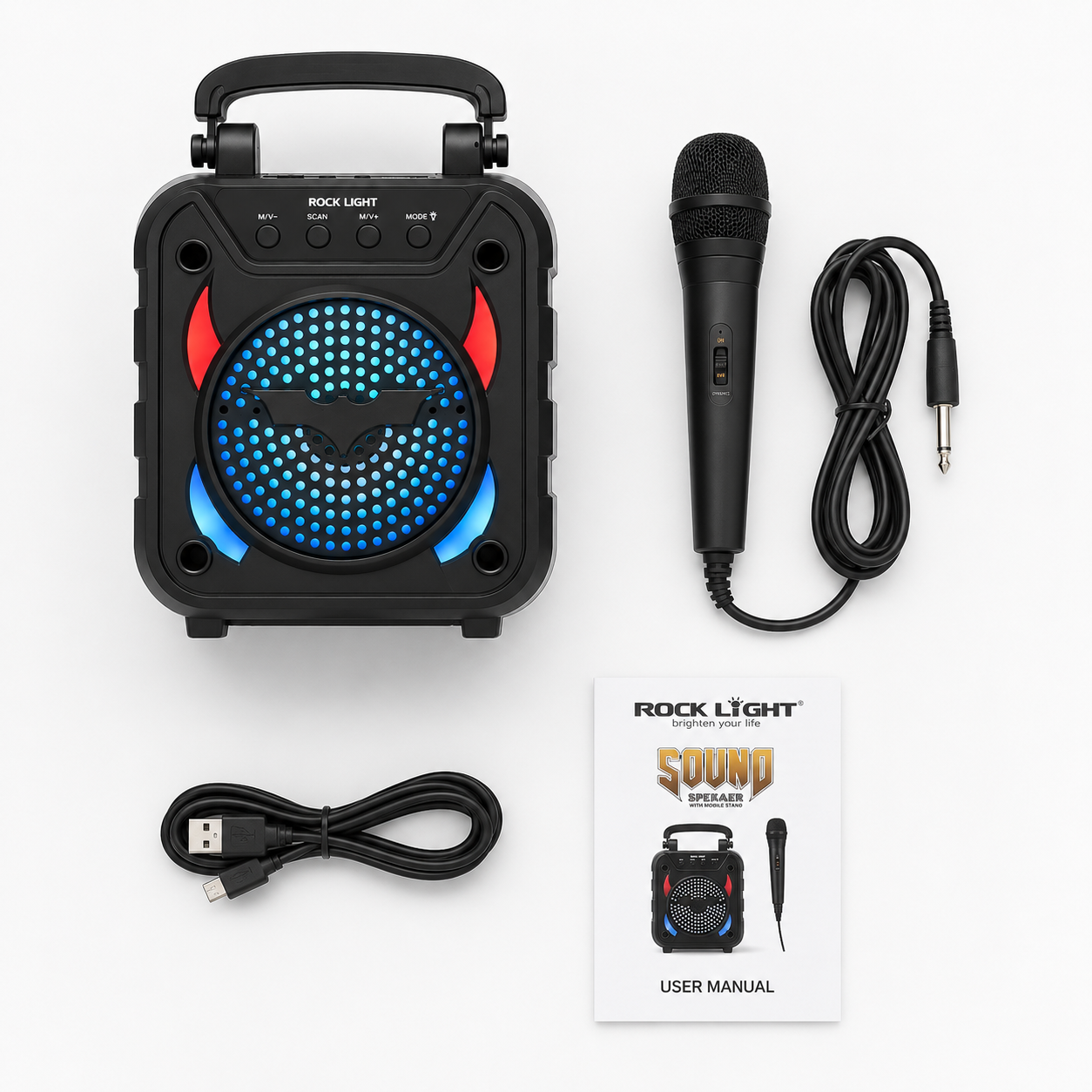 Portable Bluetooth party speaker with wired microphone, USB charging cable and user manual arranged on a white background.