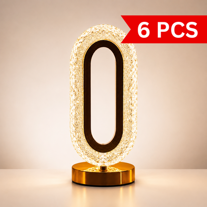 Crystal LED Table Lamp with elegant oval crystal design, warm ambient glow, gold base, rechargeable LED night light for bedroom and home décor.