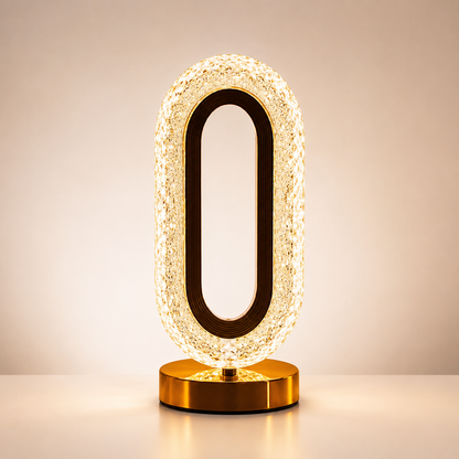 Crystal LED Table Lamp with elegant oval crystal design, warm ambient glow, gold base, rechargeable LED night light for bedroom and home décor.
