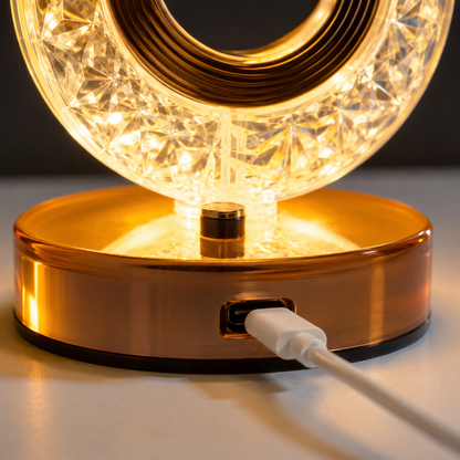 Crystal LED Table Lamp USB charging port close-up showing rechargeable connection, premium gold base, warm illuminated crystal design, modern LED night lamp detail photography.