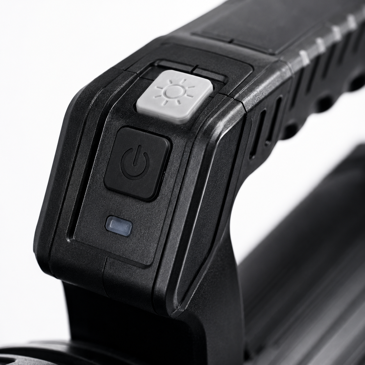 Close-up of the rechargeable LED searchlight handle featuring the power button, lighting mode switch, battery indicator and ergonomic textured grip.