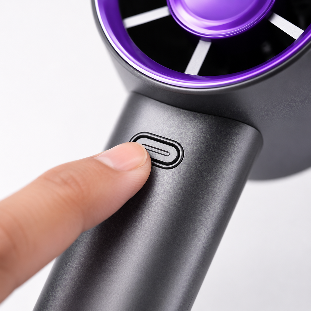 Close-up of the rechargeable handheld fan power button showing one-touch control for three adjustable fan speed settings.