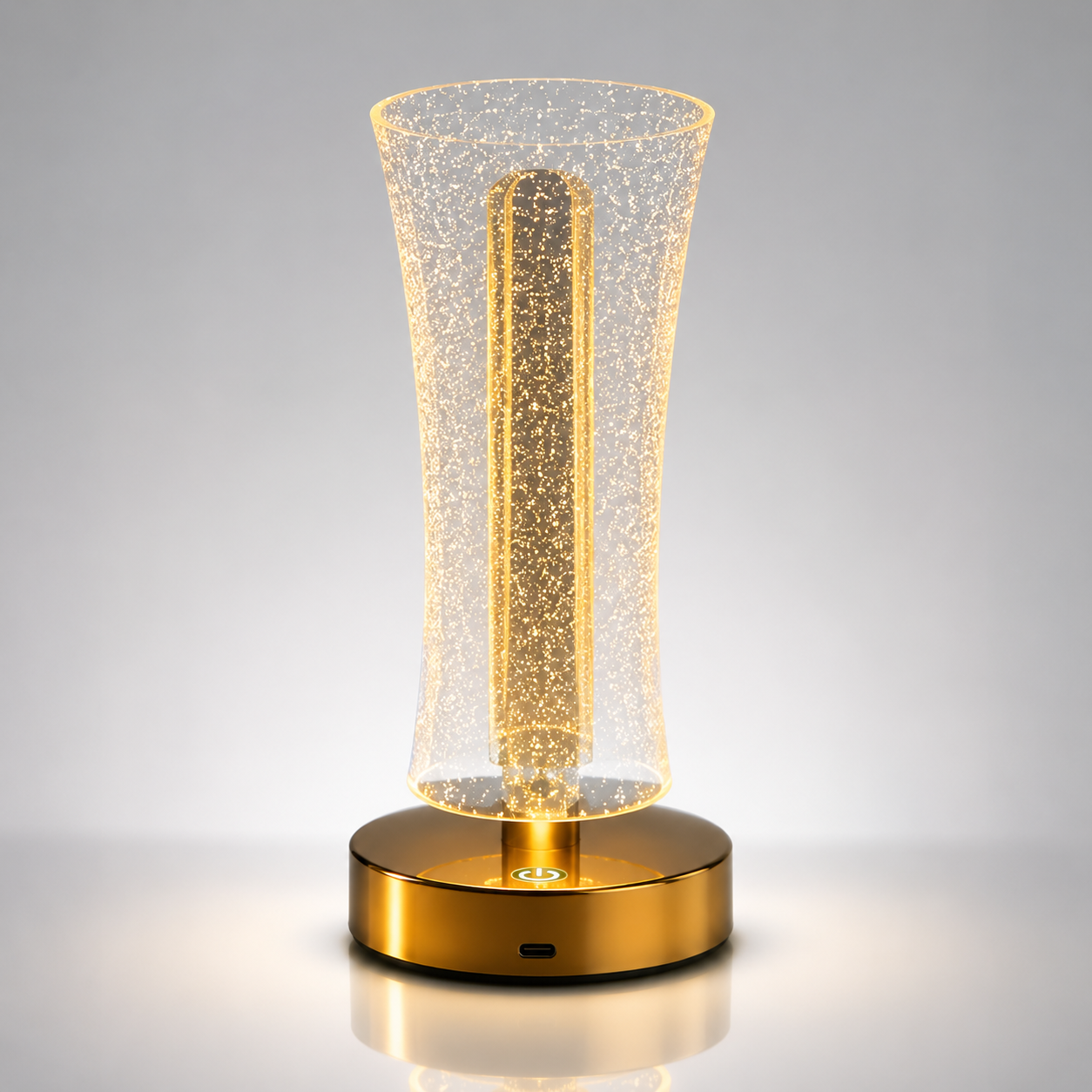 Rechargeable RGB LED table lamp with a sparkling optical acrylic shade, gold-tone base, touch power button, USB-C charging port, and warm ambient lighting on a clean studio background.