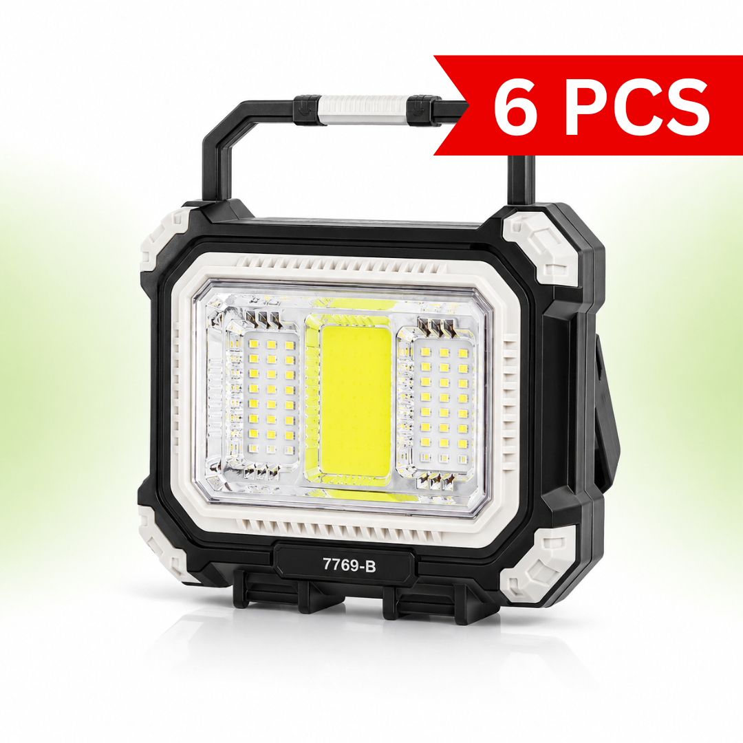 Front view of the 7769-B rechargeable solar camping light featuring a rugged black and white ABS body, ultra-bright central COB floodlight, dual LED side panels, foldable carry handle, and portable toolbox-inspired design