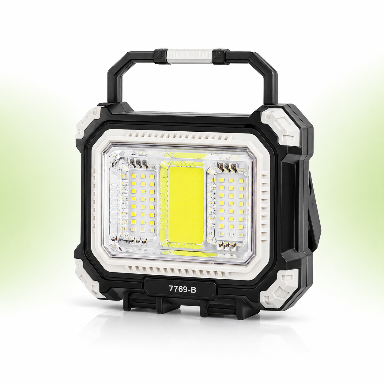 Front view of the 7769-B rechargeable solar camping light featuring a rugged black and white ABS body, ultra-bright central COB floodlight, dual LED side panels, foldable carry handle, and portable toolbox-inspired design