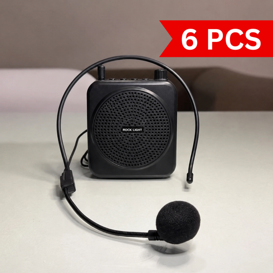 Portable wireless voice amplifier with adjustable headset microphone displayed on a clean surface, featuring a compact black design, clear sound output, rechargeable battery, and hands-free operation for teachers and trainers.