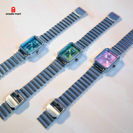 Multiple rectangular steel watches with stainless steel expansion bracelets in pink, green, and teal dials.