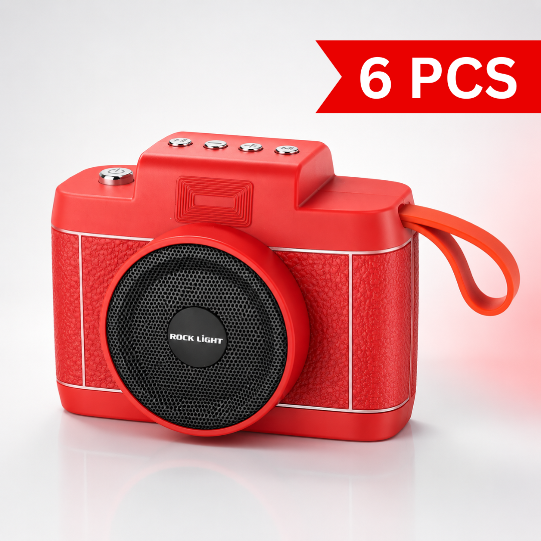 Front three-quarter view of the Rock Light Shoot S169 wireless Bluetooth speaker featuring a retro camera-inspired design, powerful front speaker grille, integrated carry strap, compact portable body, and premium red finish