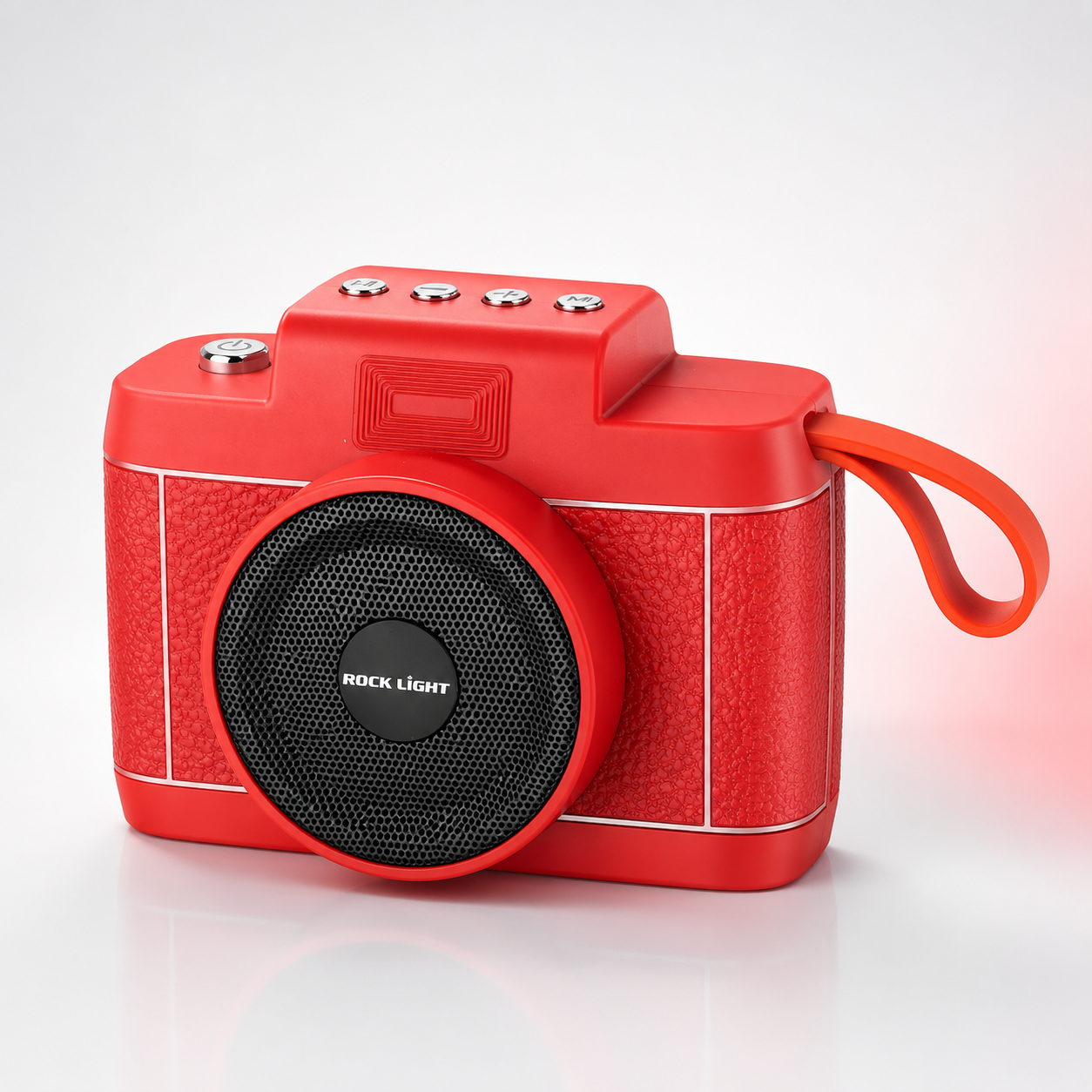 Front three-quarter view of the Rock Light Shoot S169 wireless Bluetooth speaker featuring a retro camera-inspired design, powerful front speaker grille, integrated carry strap, compact portable body, and premium red finish