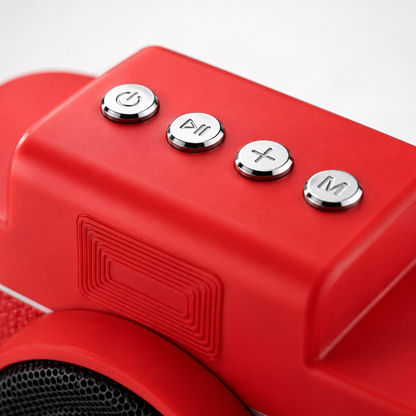 Close-up of the Rock Light Shoot S169 portable Bluetooth speaker showcasing premium metallic control buttons for power, play/pause, volume adjustment, and mode selection on a vibrant red camera-style body with a textured finish.
