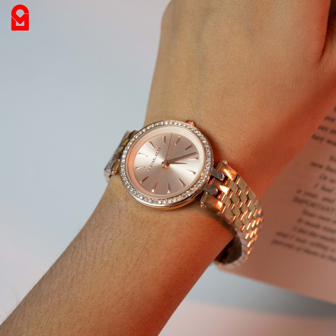 Rose gold women’s bracelet watch worn on wrist showing elegant luxury styling.