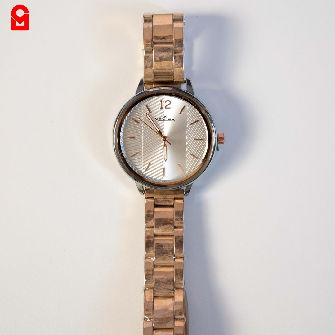 Rose gold women’s bracelet watch with textured dial displayed on white background.