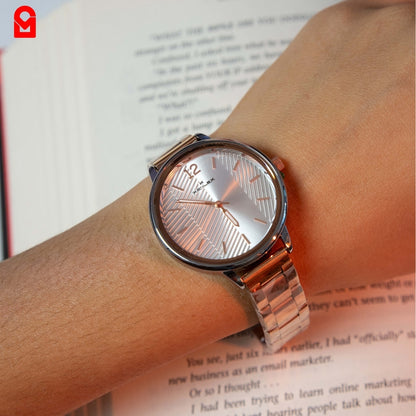 Women’s rose gold bracelet watch worn on wrist showing minimalist analog dial design.