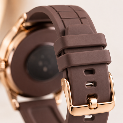 Close-up of the soft brown silicone strap with textured finish, adjustable buckle and comfortable fit, highlighting the durable everyday wear design and premium hardware.