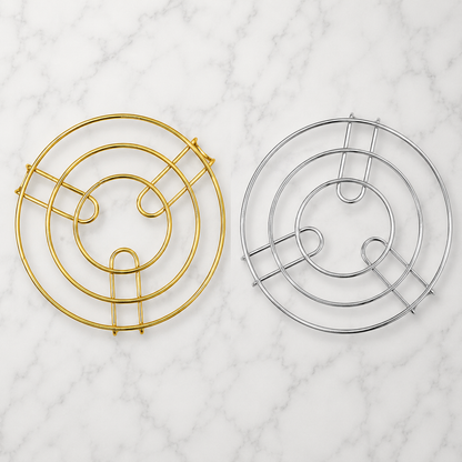 Round Metal Kitchen Trivet Stand available in gold and silver finishes, premium wire pot stand for hot dishes, cookware, and kitchen table protection.