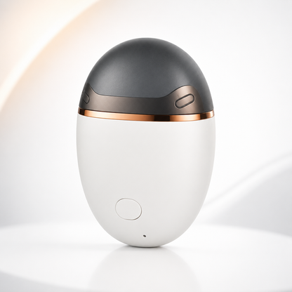 Premium studio photograph of a compact electric nail clipper featuring a matte white body, charcoal grey top, rose gold metallic accents, and a single power button.