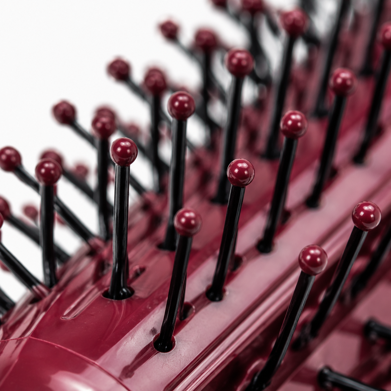 Close up view of round hair brush bristles with ball tips for smooth hair styling