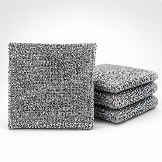 Stack of reusable silver wire kitchen cleaning cloths featuring a durable metal mesh design for scrubbing cookware, dishes, sinks and other kitchen surfaces.