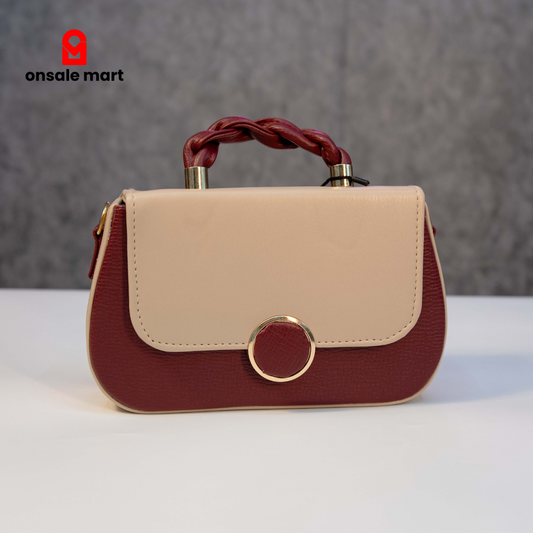 Elegant maroon and beige two-tone crossbody sling bag with gold ring closure.